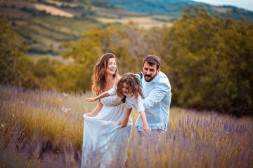 Happy family in lavender field.