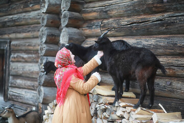 Traditional Slavic rituals in the rustic style. Outdoor in summer. Slavic village farm. Peasants in elegant robes.