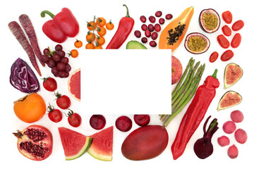 Healthy food high in lycopene for good health with a collection of fruit and vegetables with white card. High also in antioxidants, dietary fibre, anthocyanins, minerals and vitamins. Copy space.