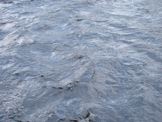 Background of a stormy mountain gray and blue river.