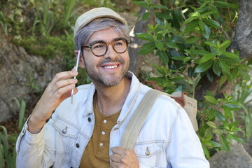 Mature man calling by phone outdoors