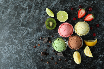 Obraz na płótnie Canvas Fruit ice cream and ingredients on black smokey background