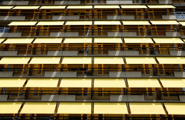 yellow sunshades on building