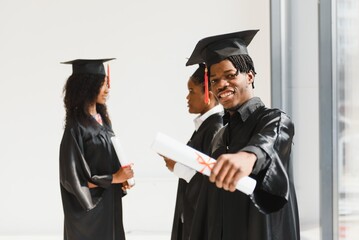 optimistic young university graduates at graduation