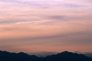 Fototapeta na wymiar Sunset sky and silhouette mountains