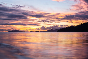 Fototapeta premium sunset view with twilight sky of Sunset beach of Lipe island, Thailand. Lipe island is known as Maldives of Thailand because there beautiful beach with clear sea water and fantastic coral reef