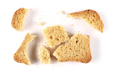 Broken wholemeal cracker, bread rusk, toast slice crumbs isolated on white background, top view