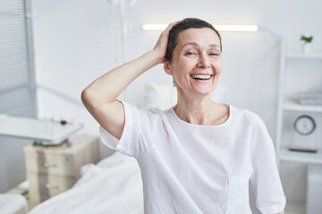 Fototapeta premium Portrait of happy mature woman smiling at camera she recovering from illness