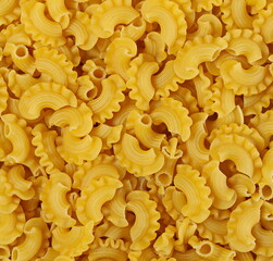 Pasta cornetti creste pile background and texture