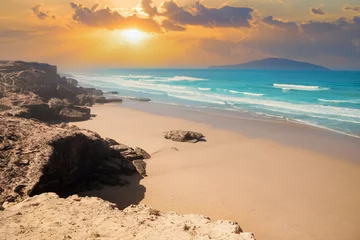 Poster Beautiful sunset illuminating the Agadir beach and sand on the Atlantic  ocean coast in Morocco © cristianbalate