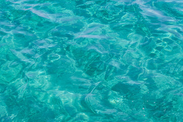 Fototapeta na wymiar Azure clear sea water glaring in the sun, Black Sea, Cyprus