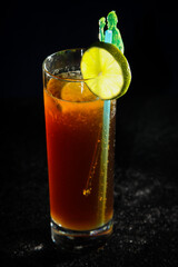 Long Island Ice Tea Cocktail on black background