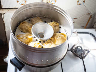 aluminum steamer with cooking homemade manti - obrazy, fototapety, plakaty