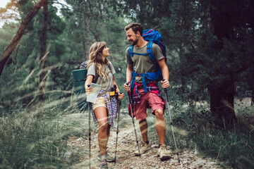 Young couple hiking together in mountains