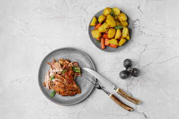 Pulled lamb meat baked in oven with potato and carrot