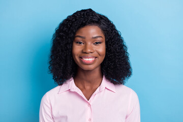 Photo of charming adorable dark skin lady dressed pink clothes smiling isolated blue color background