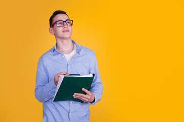 A handsome guy in a blue shirt  on a yellow background