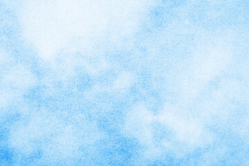 Blue ink splashes on white paper. Spray paint grain background. Heaven texture. Blue cloudy sky abstract pattern. Noise backdrop.