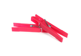 Bright pink plastic clothespins on white background