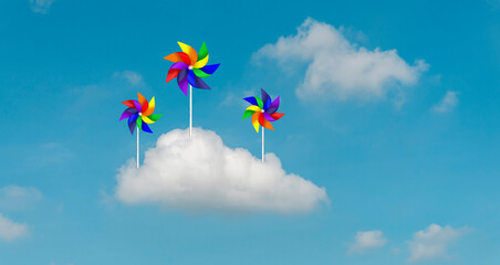 Colorful blades turbines on white cloud, paper rainbow windmill illustration