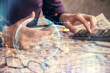 Fototapeta premium Multi exposure of man's hands holding and using a digital device and map drawing. International business concept.