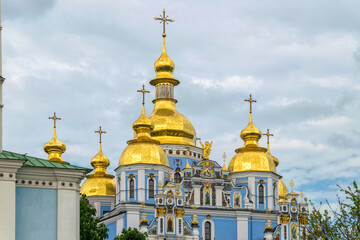 Fototapeta na wymiar Kyiv, Ukraine - May 14 2021: majestic St. Michael's Golden-Domed Cathedral in Kyiv and the evening sky. Famous historical monument in Kievan Rus. Ancient Christian Orthodox churches with golden domes
