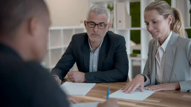 Business couple signing contract for new offices aquisition 