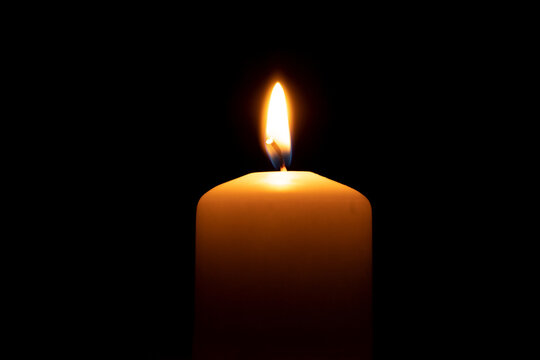 Fire candles on a black background, side view