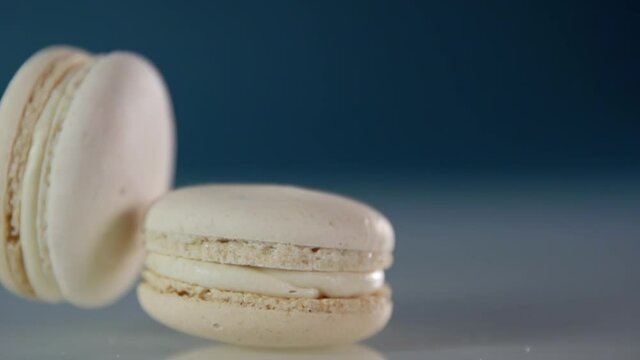 One macaroon falls on top of another macaroon in slow motion