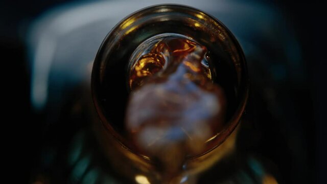 Liquor is being poured from bottle