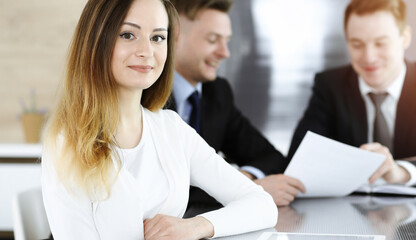 Fototapeta premium Business woman headshot in sunny office. Unknown businesswoman sitting behind computer monitor