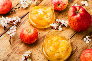 Homemade apple jam and red apples
