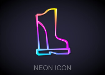 Fototapeta premium Glowing neon line Waterproof rubber boot icon isolated on black background. Gumboots for rainy weather, fishing, gardening. Vector