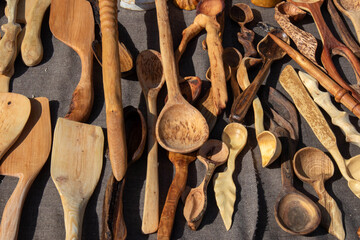 The trade tent with wooden cutlery at the open air village fair 