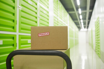 Close-up of cardboard boxes on trolley in the warehouse
