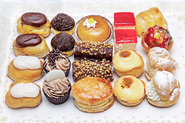 tray of cupcakes of varied flavors of Spanish pastry