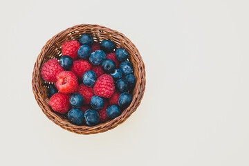 fresh berries in a wicker basket top view
