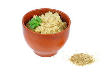 Cooked white quinoa in clay bowl isolated on a white background