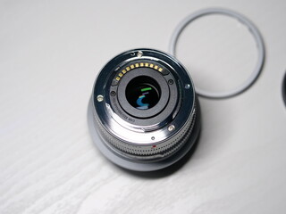 A very delicate and compact silver metal prime lens rear mount