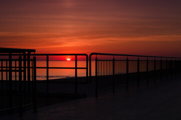 Fototapeta na wymiar SUNRISE OVER THE SEA - Morning on the seashore 