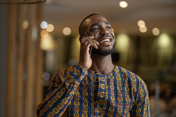 Black African business entrepreneur smiling conversation on phone