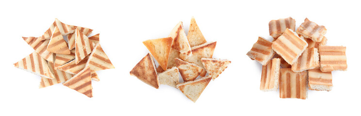 Set with delicious crispy pita chips on white background, top view. Banner design