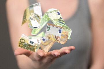 bill euro banknote in hand rain