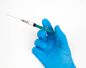 hand holding syringe, ready for vaccination