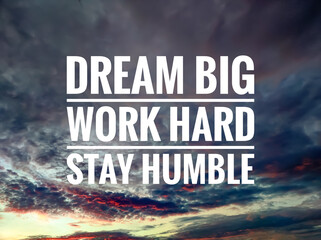 Text DREAM BIG WORK HARD STAY HUMBLE with sunrise background.Motivation quote.
