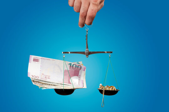 Azerbaijan manat and US dollar and gold on scale