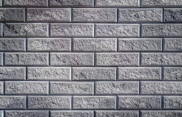 Texture of gray brick wall close up for background