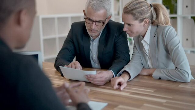 Business couple signing contract for new offices aquisition 