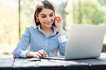 European businesswoman work on laptop outdoors