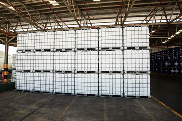 Chemistry white tank on pallets are storage in the warehouse factory